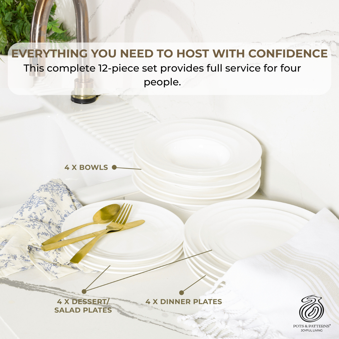 White dinnerware set with gold cutlery on a white surface, featuring text about the set's capacity for four people.
