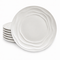 Stack of six Natural Waves white porcelain dinner plates with a sculpted wave pattern