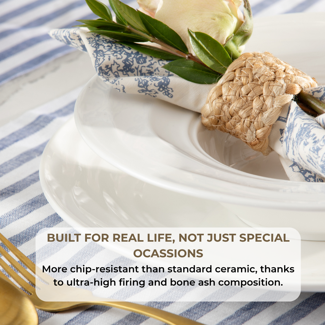 Natural Waves plate and bowl place setting with a floral napkin, greenery, and gold flatware, highlighting chip- and stain-resistant bone china